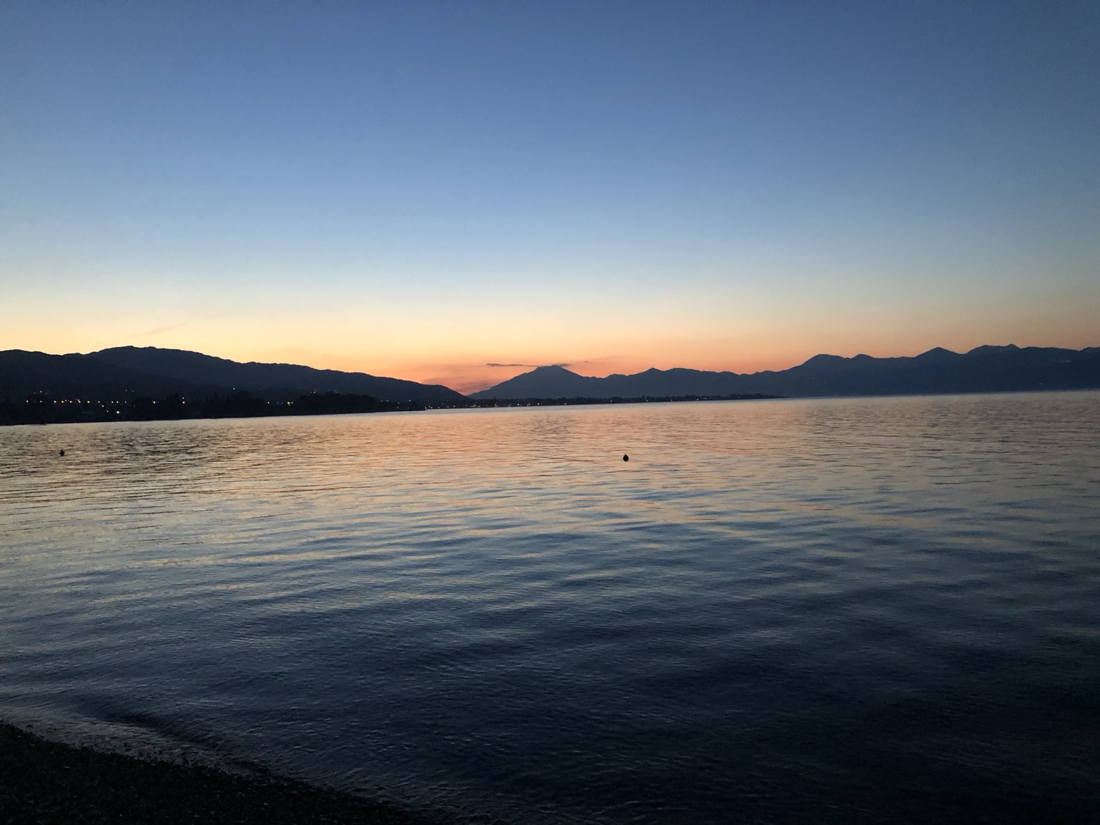 Sunset over the Gulf of Corinth as seen from Ellinikon taverna, Akoli Beach, Rododafni, Achaia, Greece